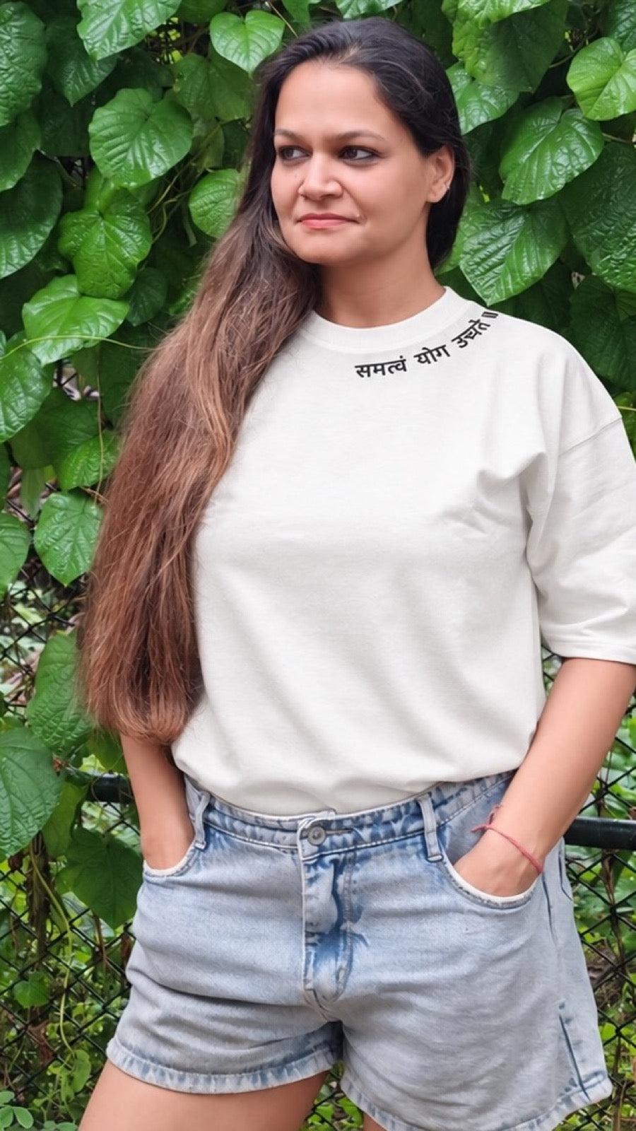 Motivation Unlimited Chalk White T-shirt worn outdoors, tall editorial fit view