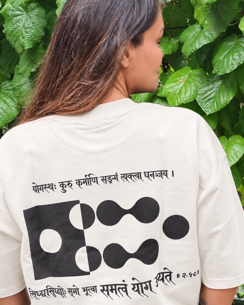 Motivation Unlimited Chalk White T-shirt worn outdoors, print-focused editorial back view