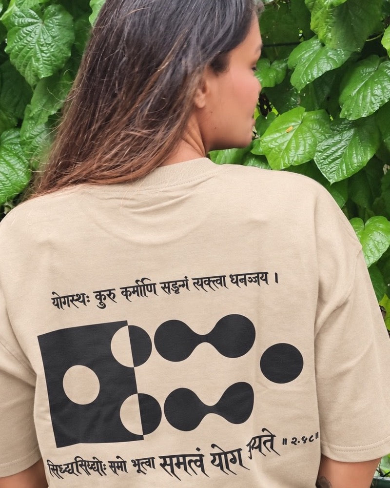 Motivation Unlimited Sandy Beige T-shirt worn outdoors, print-focused editorial back view