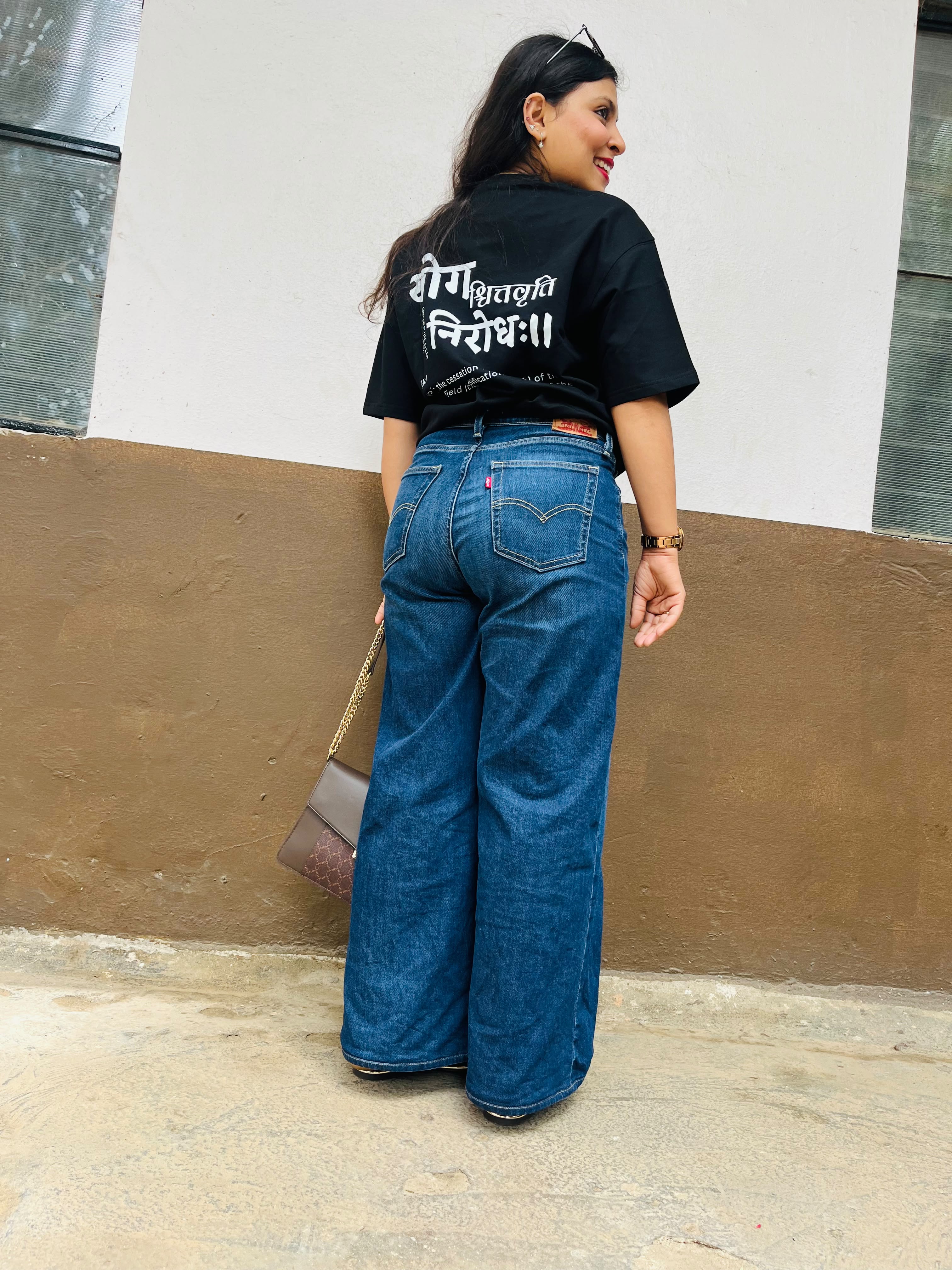 Don’t Overthink It T-shirt in Raven Black, worn outdoors, full-length back view
