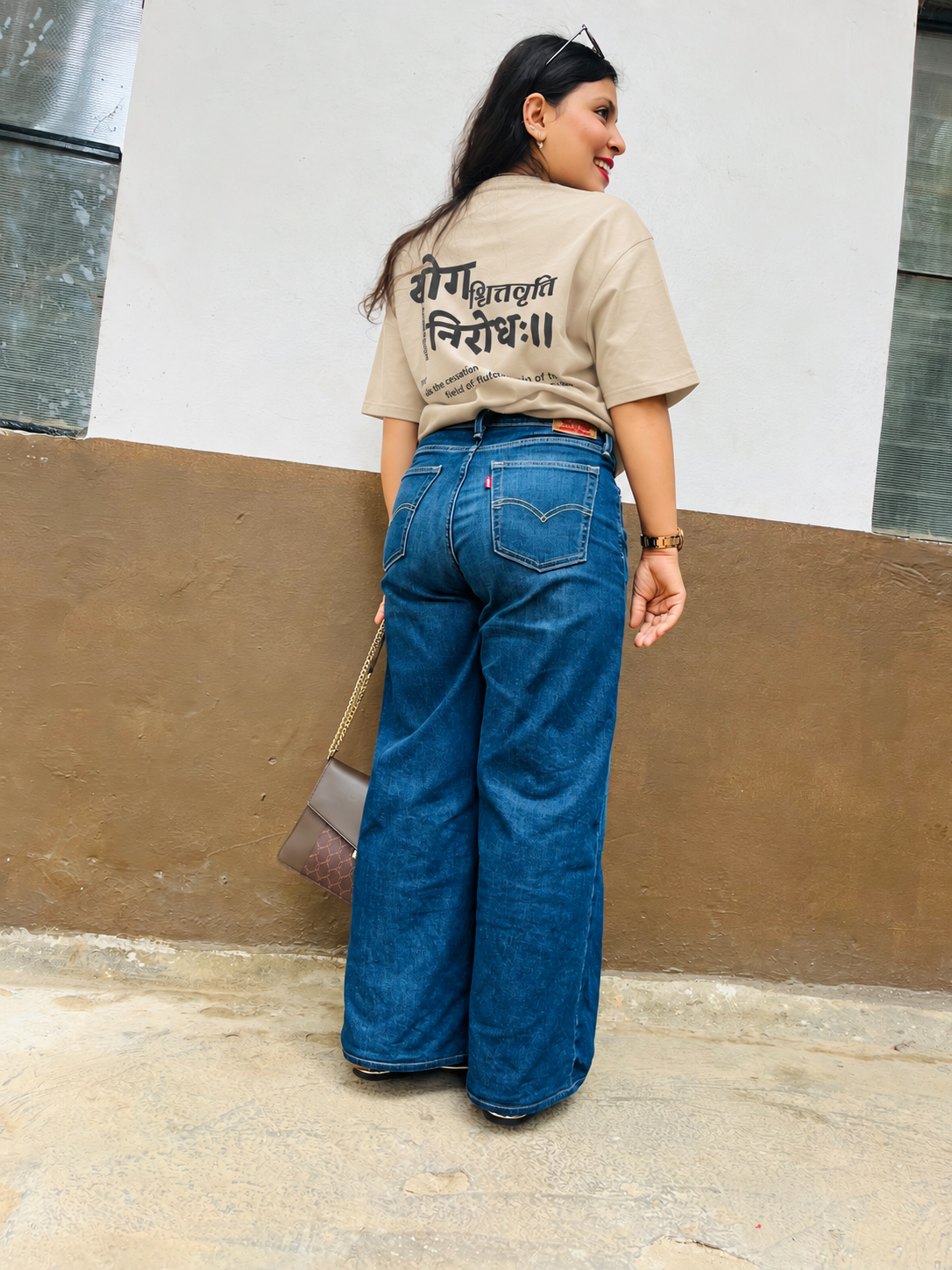 Don’t Overthink It T-shirt in Sandy Beige, worn outdoors, full-length back view