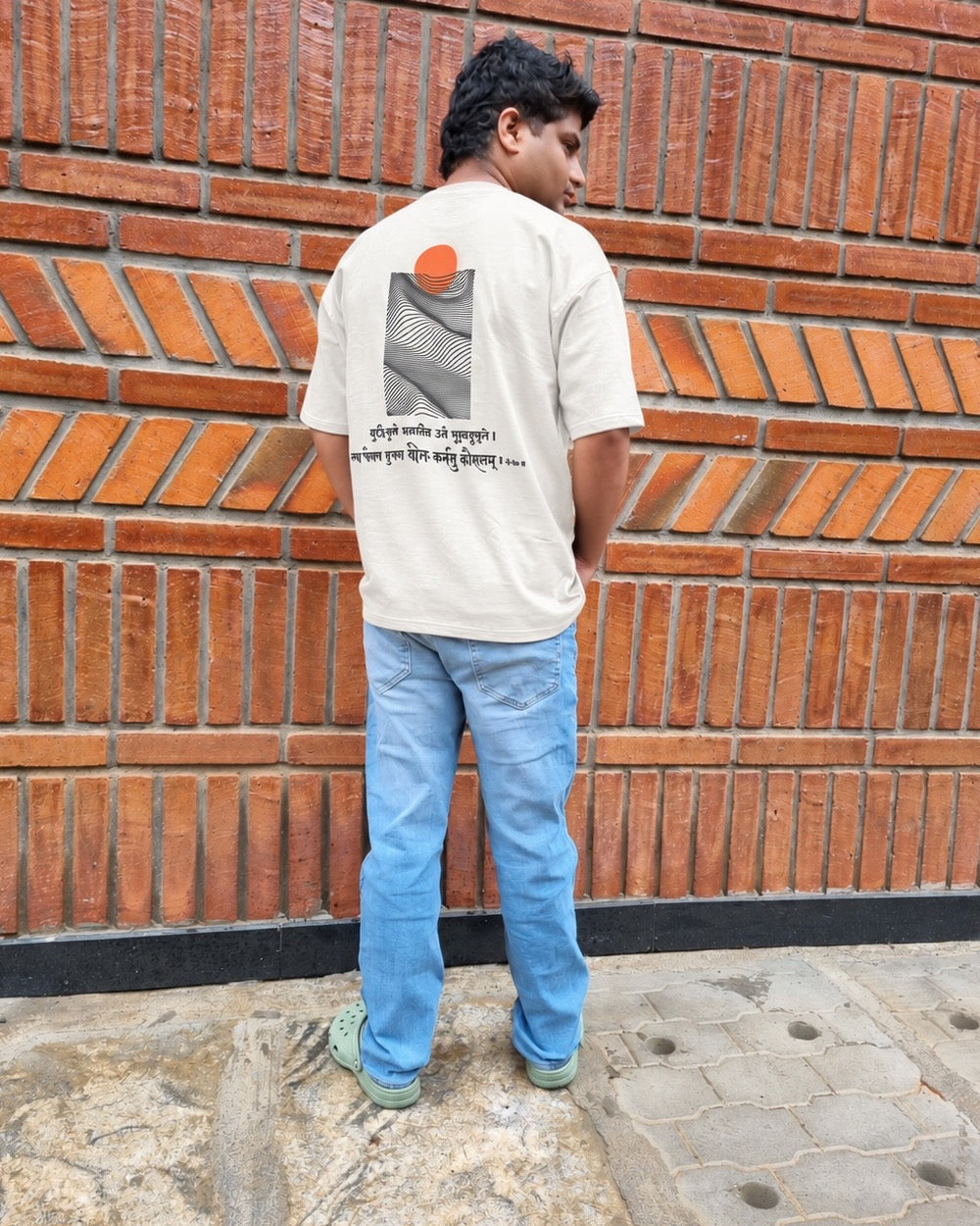 Skillful Action Chalk White T-shirt worn outdoors, full-length back view