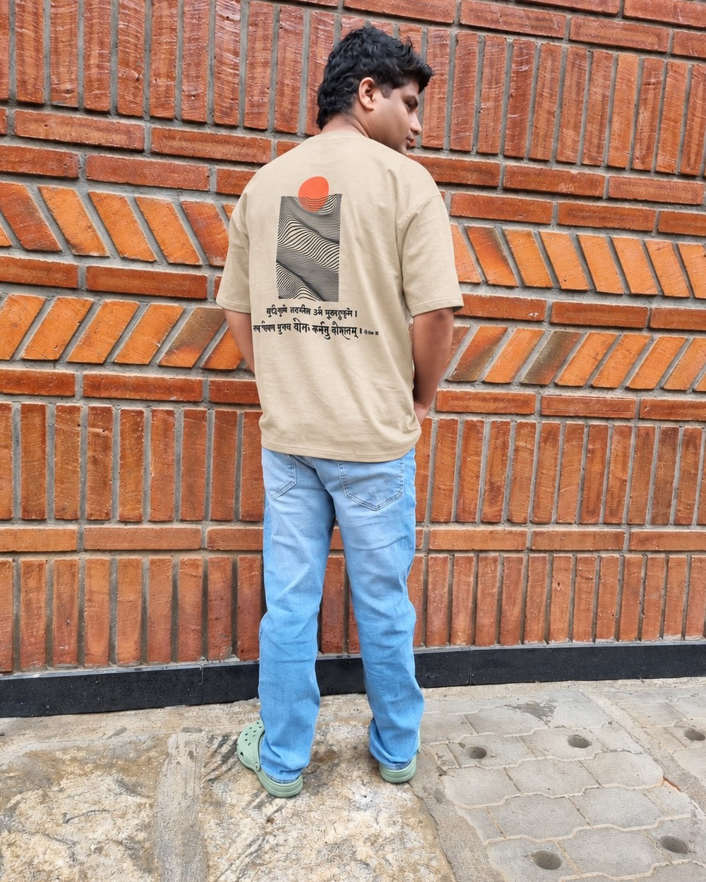 Skillful Action Sandy Beige T-shirt worn outdoors, full-length back view