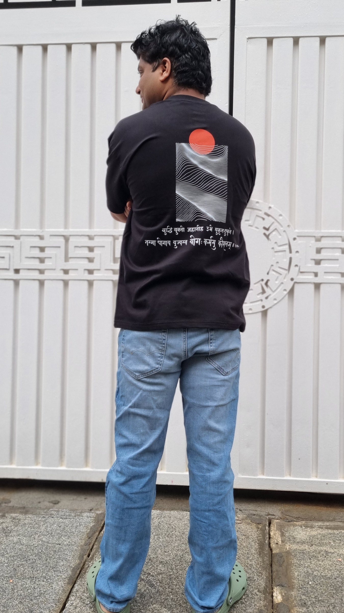 Skillful Action Raven Black T-shirt worn outdoors, full-length back view