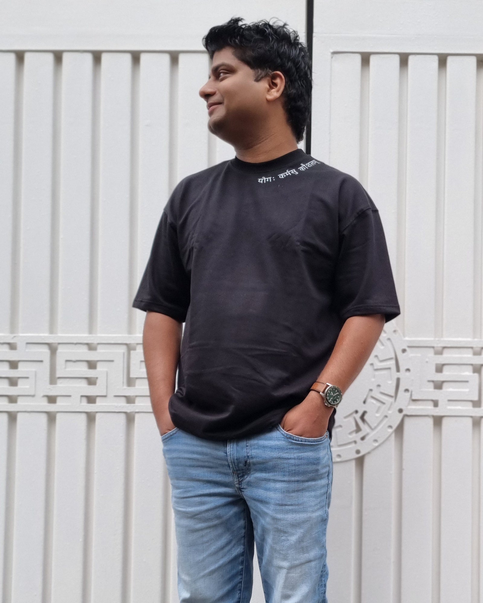 Skillful Action Raven Black T-shirt worn outdoors, close editorial front view