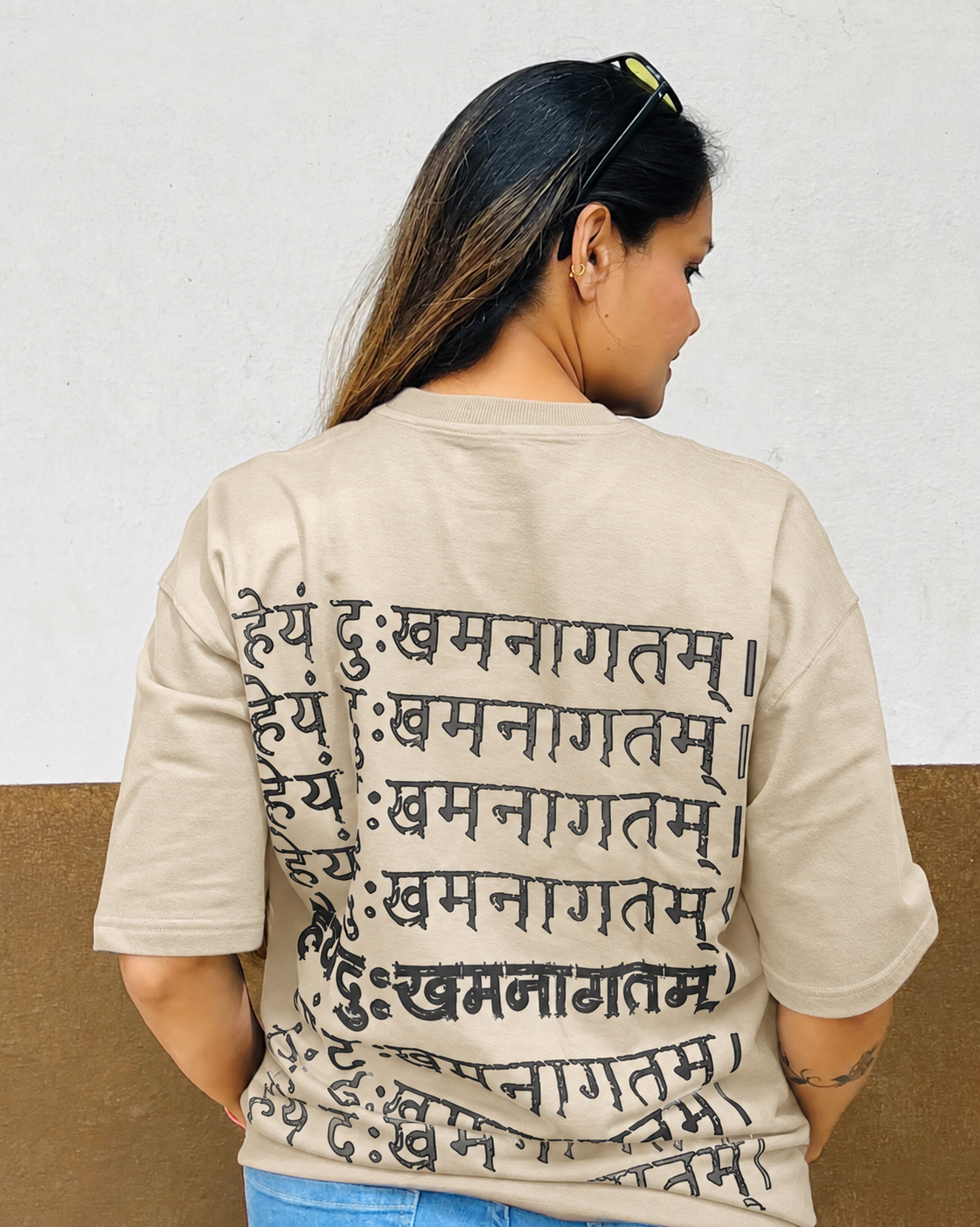 Sandy Beige colour preview of Future Manifested II, waist-up back view